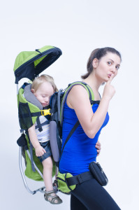 A young woman trekking with her baby